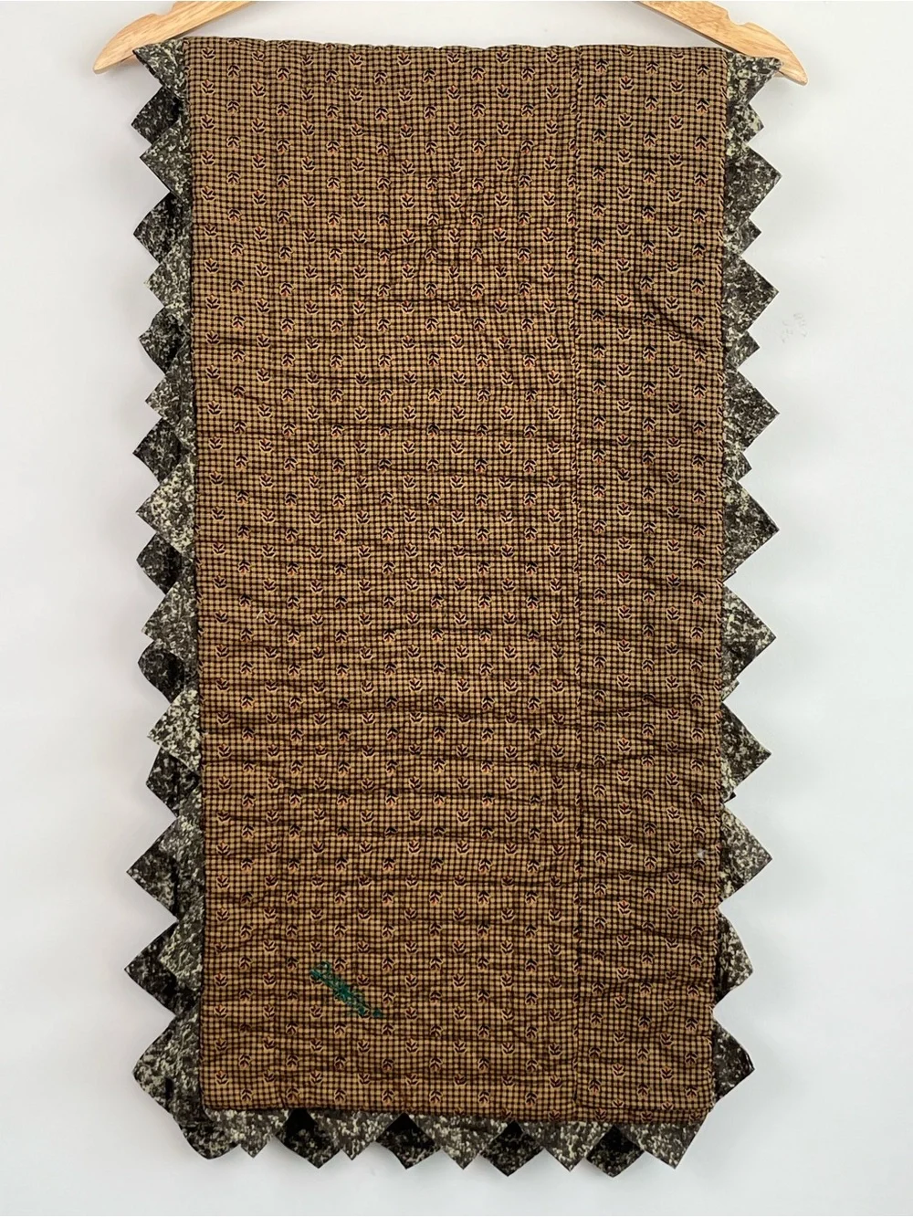 Donna Sharp quilted log cabin saw tooth trimmed table runner.